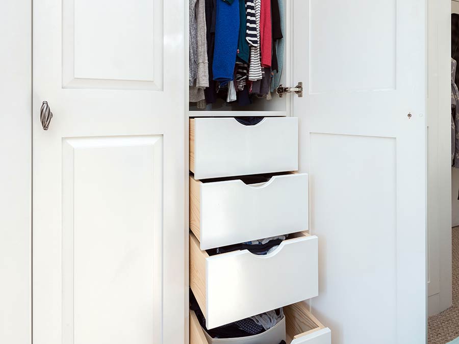 bespoke storage solution in a white wardrobe in the from of custom drawers