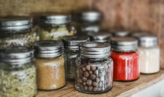 spices in jars sat on shelf
